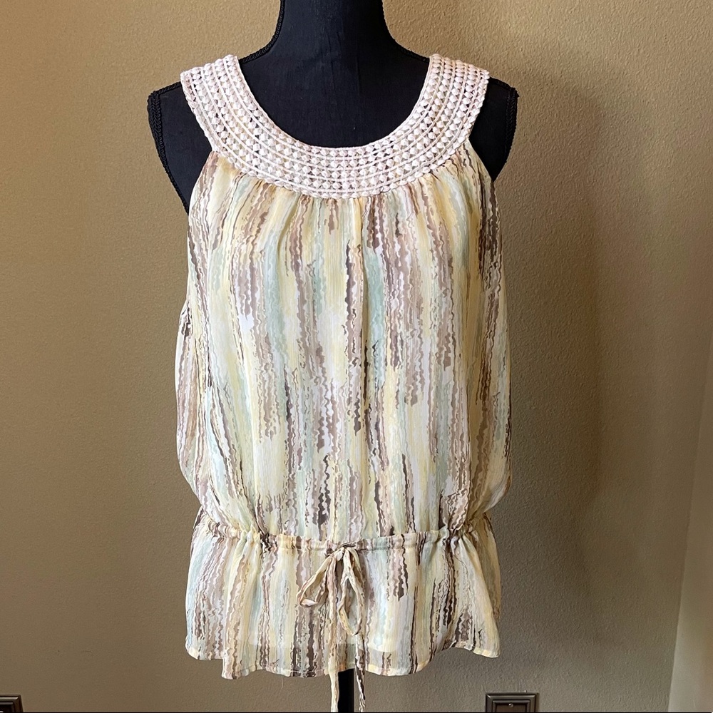 Woman’s pastel sleeveless top.  DILLARDS Size small